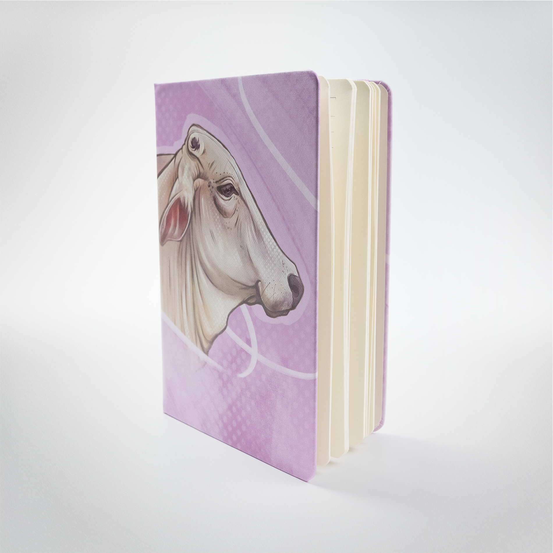 Journel A5 Leatherette purple back ground with Brahman cow head drawn by Tara Leslie, local artist.