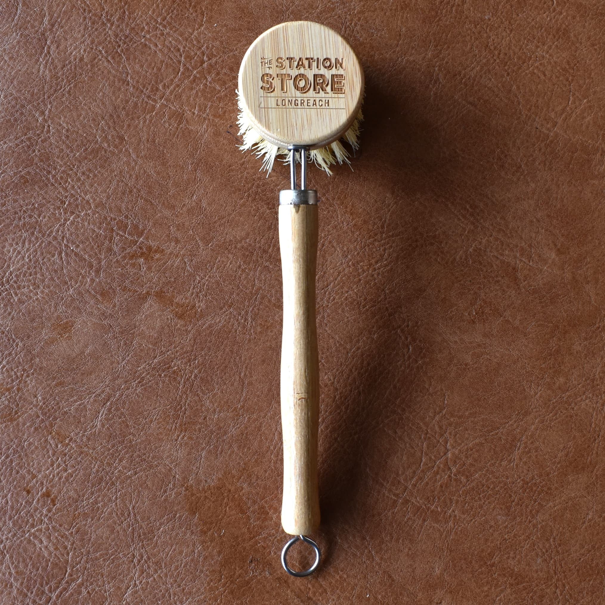 Bamboo Dish Brush with removable head and long handle featuring the Station Store branding.
