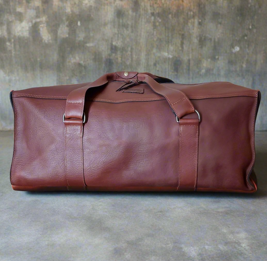 Kinnon and Co branded, tan leather large Family bag.