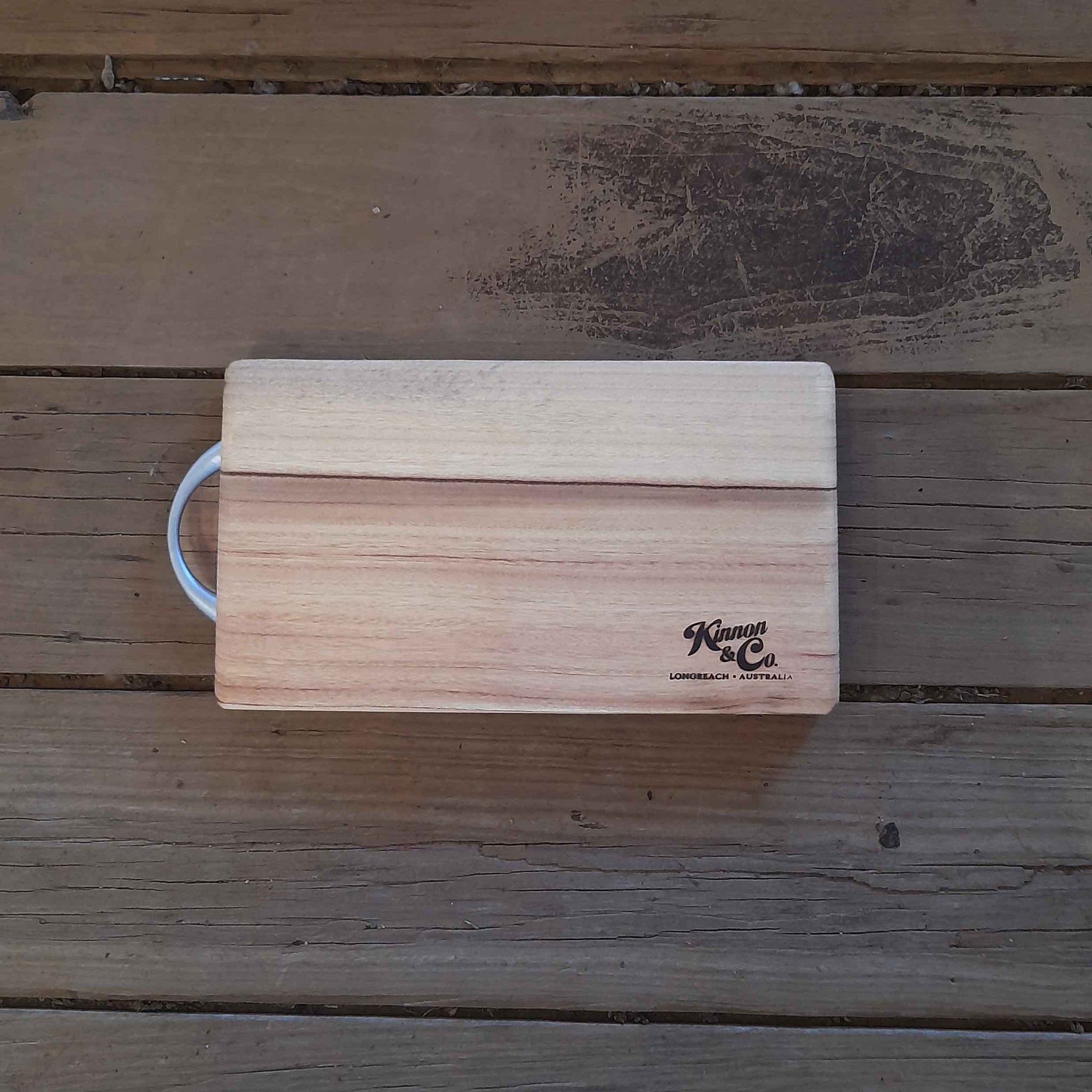 Kinnon and Co. Longreach Australia branded rectangular Camphor Laurel Chopping Board with Stainless Steel Handle. Small.