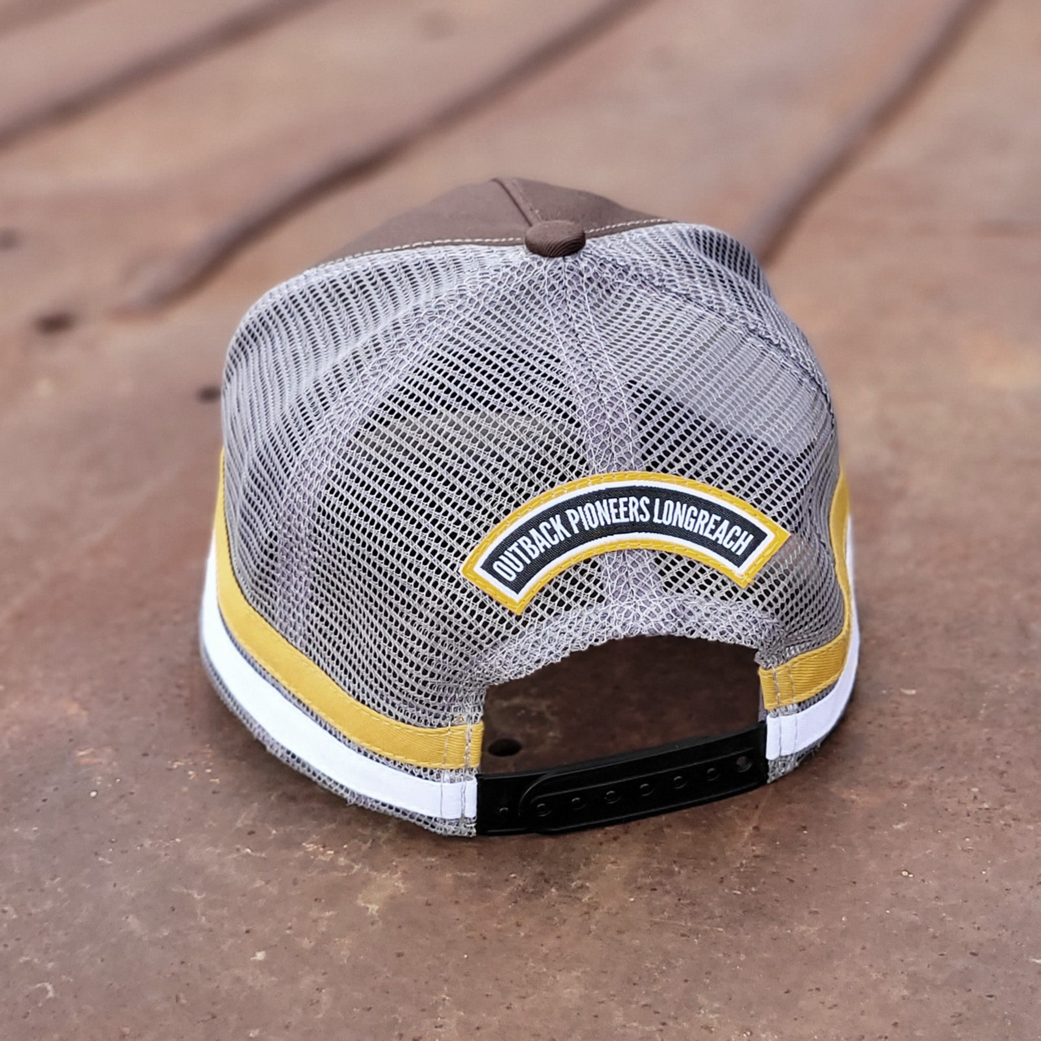 Outback Pioneers country truckers cap brown, yellow and grey.