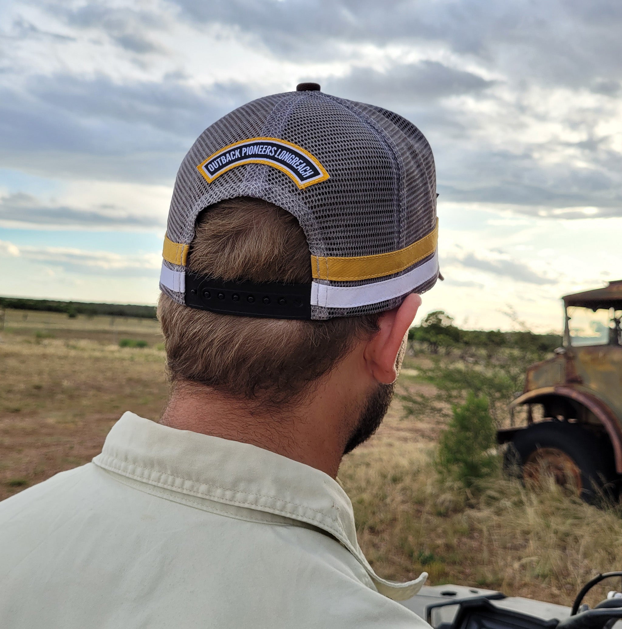 Outback Pioneers country truckers cap brown, yellow and grey.