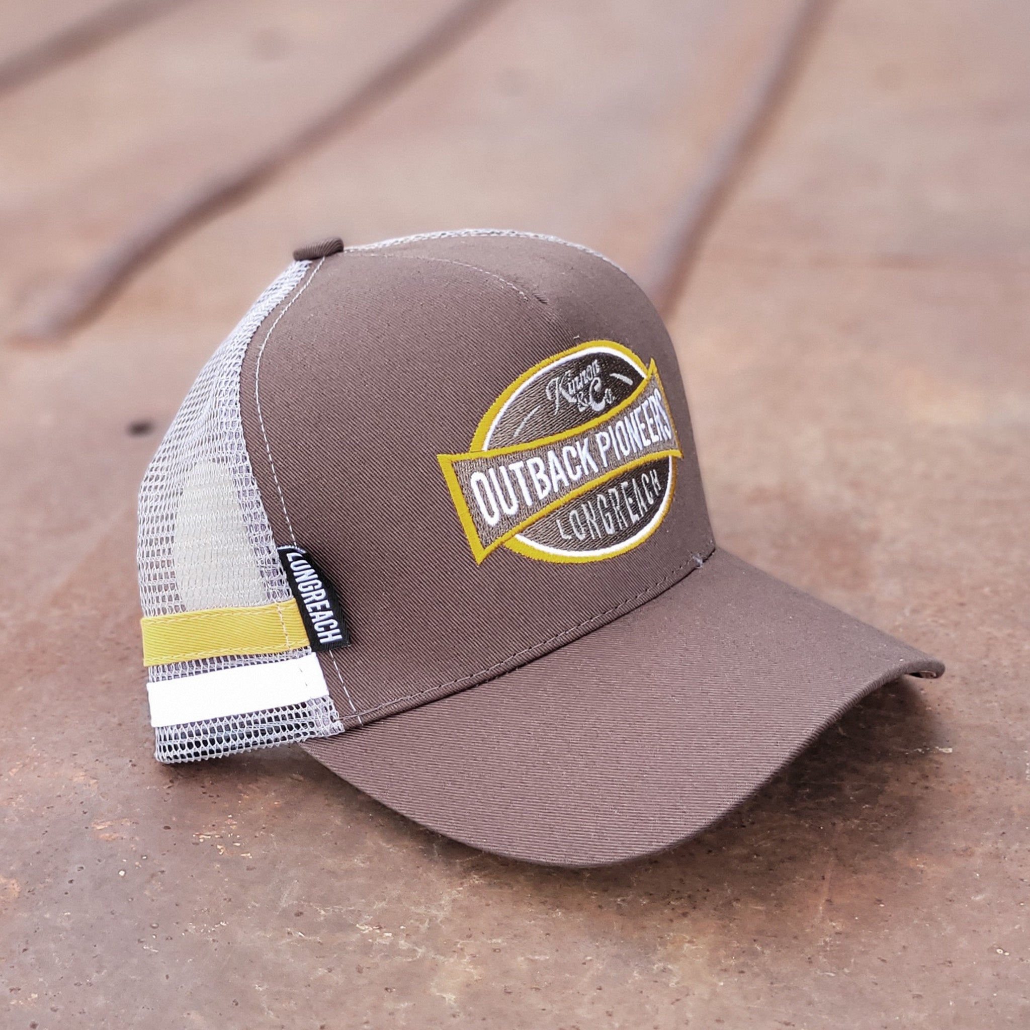 Outback Pioneers country truckers cap brown, yellow and grey.
