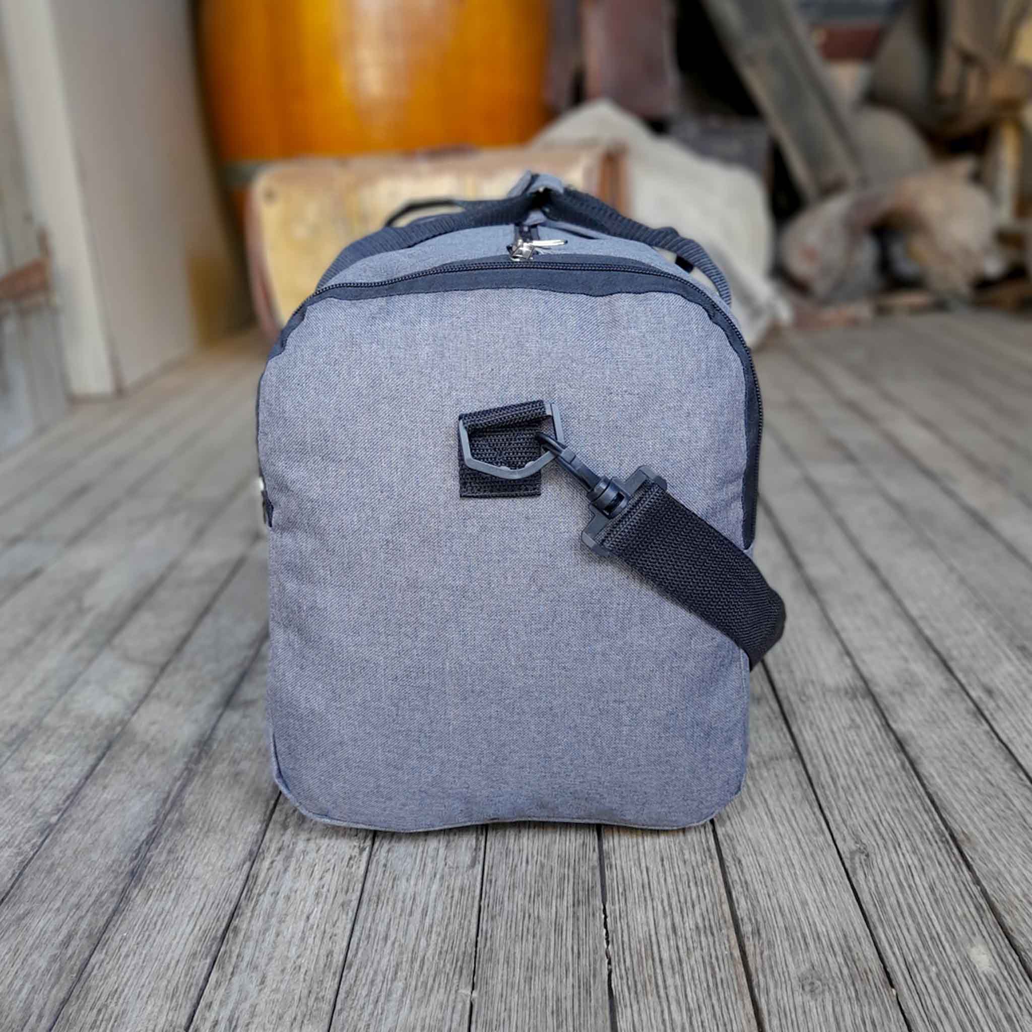 Outback Pioneers branded Black and Grey Duffle Bag. Carry on size. Side view