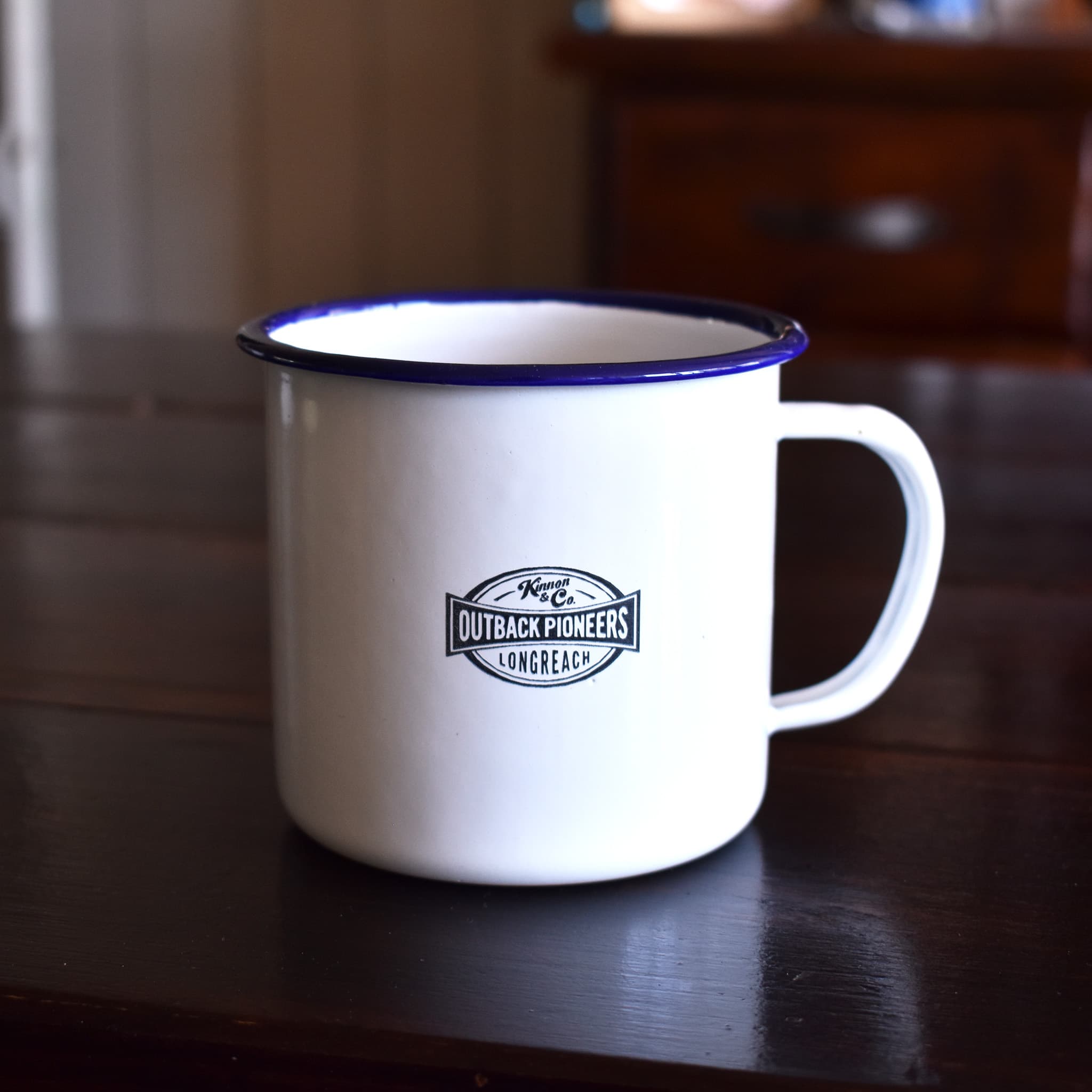 Outback Pioneers branded white enamel mug