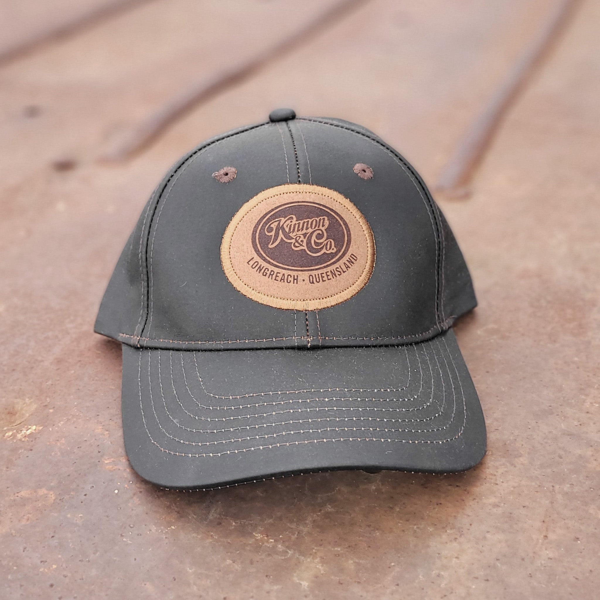 Kinnon and Co brown oilskin look cap.