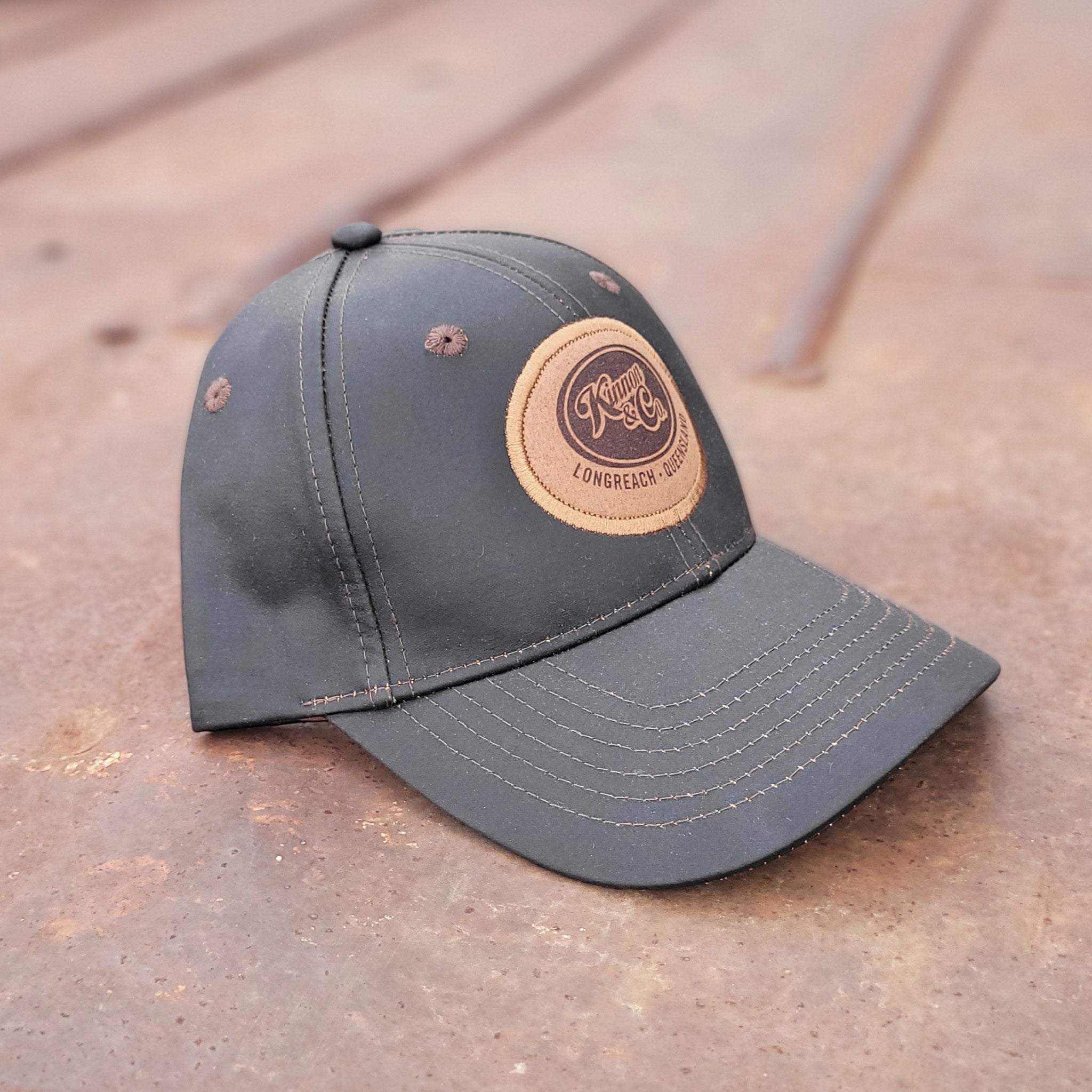 Kinnon and Co brown oilskin look cap.