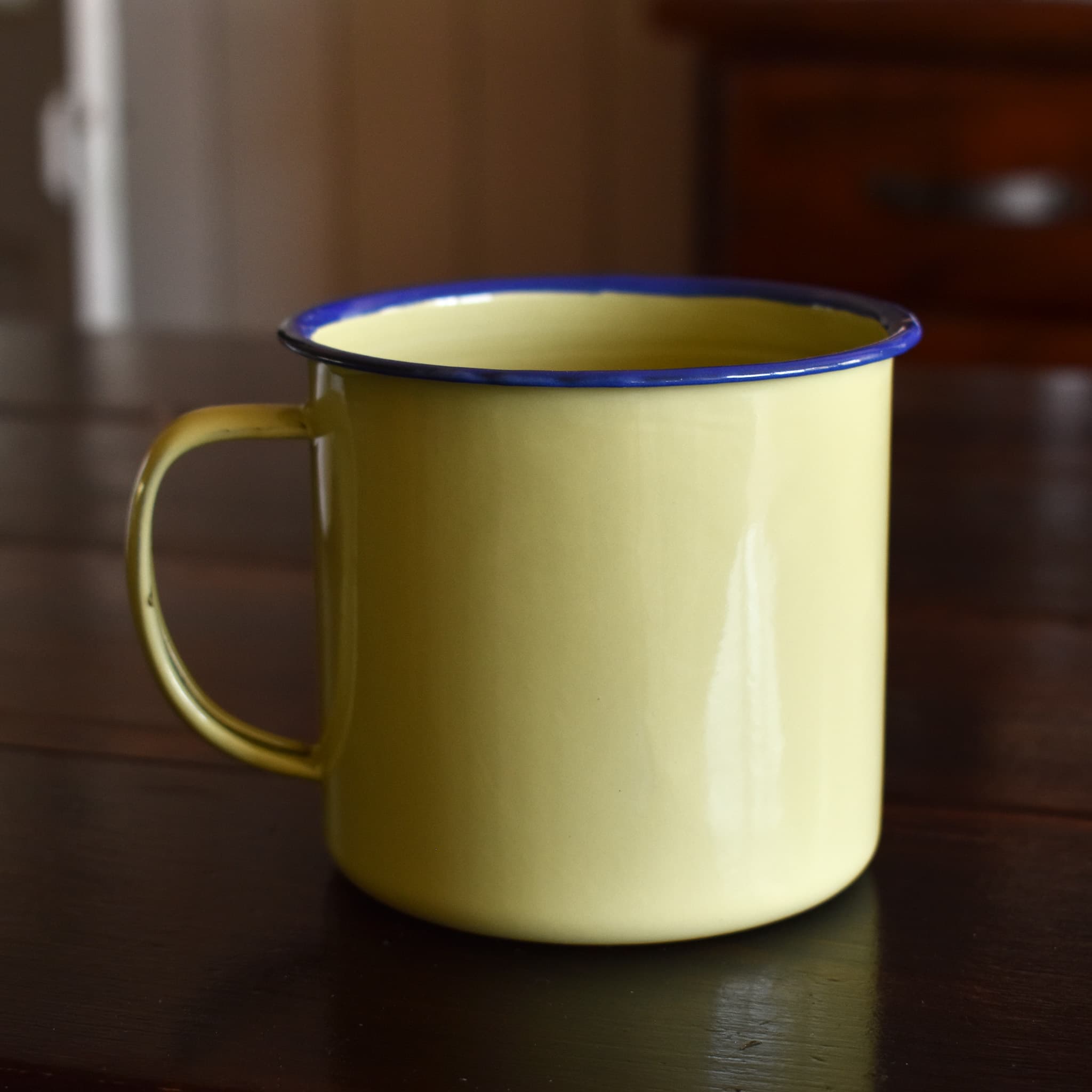The Station Store, Longreach enamel mug, green, 10cm, back view.