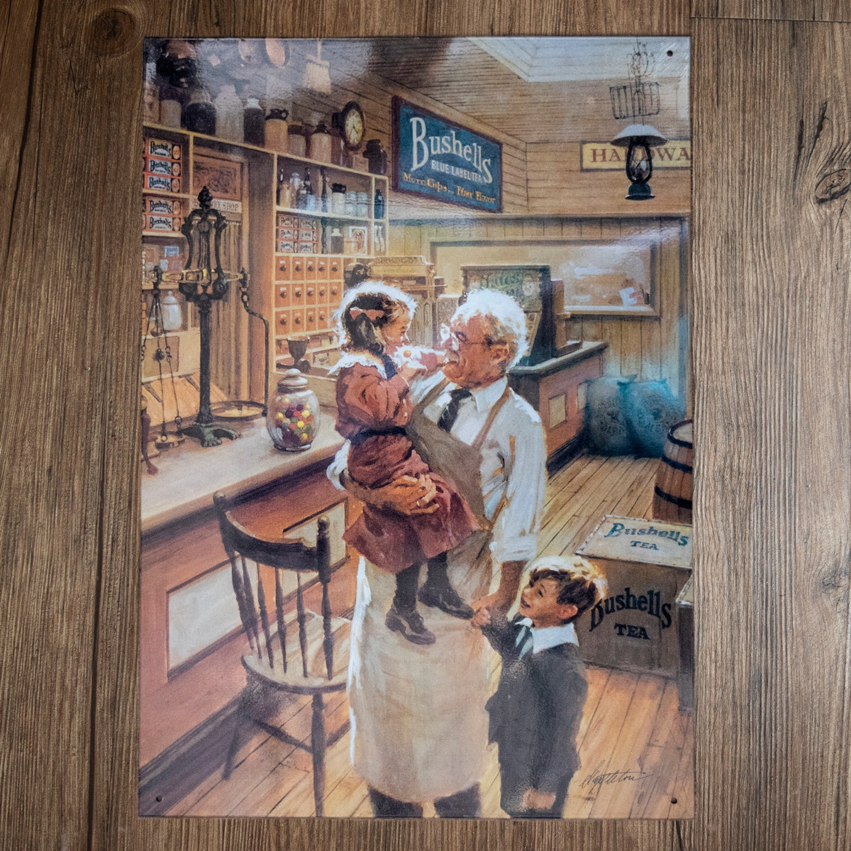 Bushell's Shop Interior Tin Sign. White haired man with two children in shop.