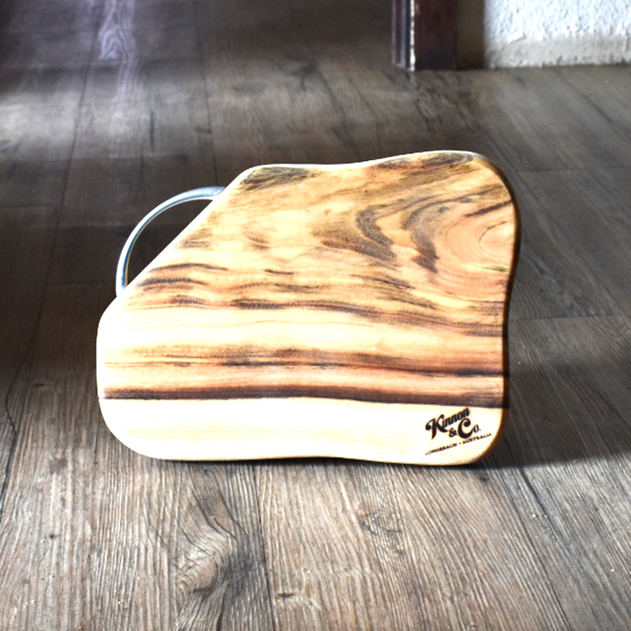 Wooden chopping board with rustic timber background