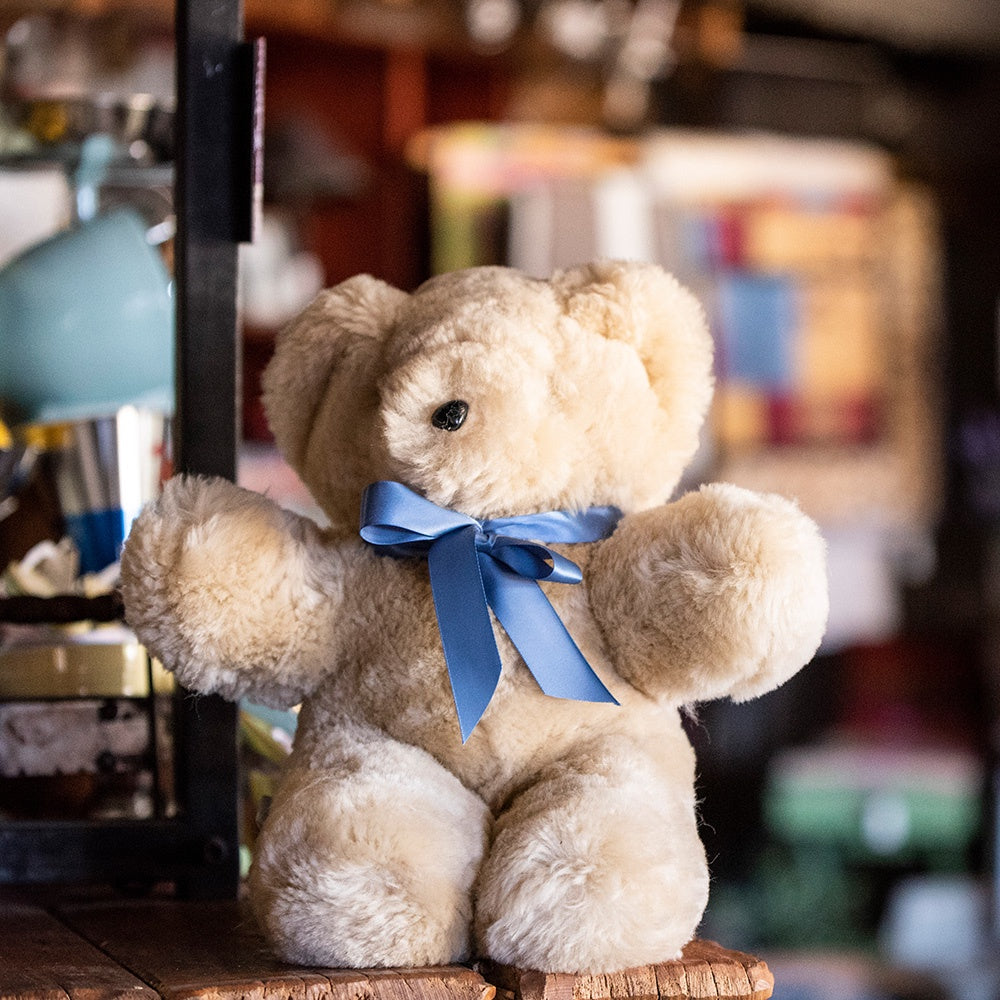 Tambo Teddy Bear with Blue ribbon around neck