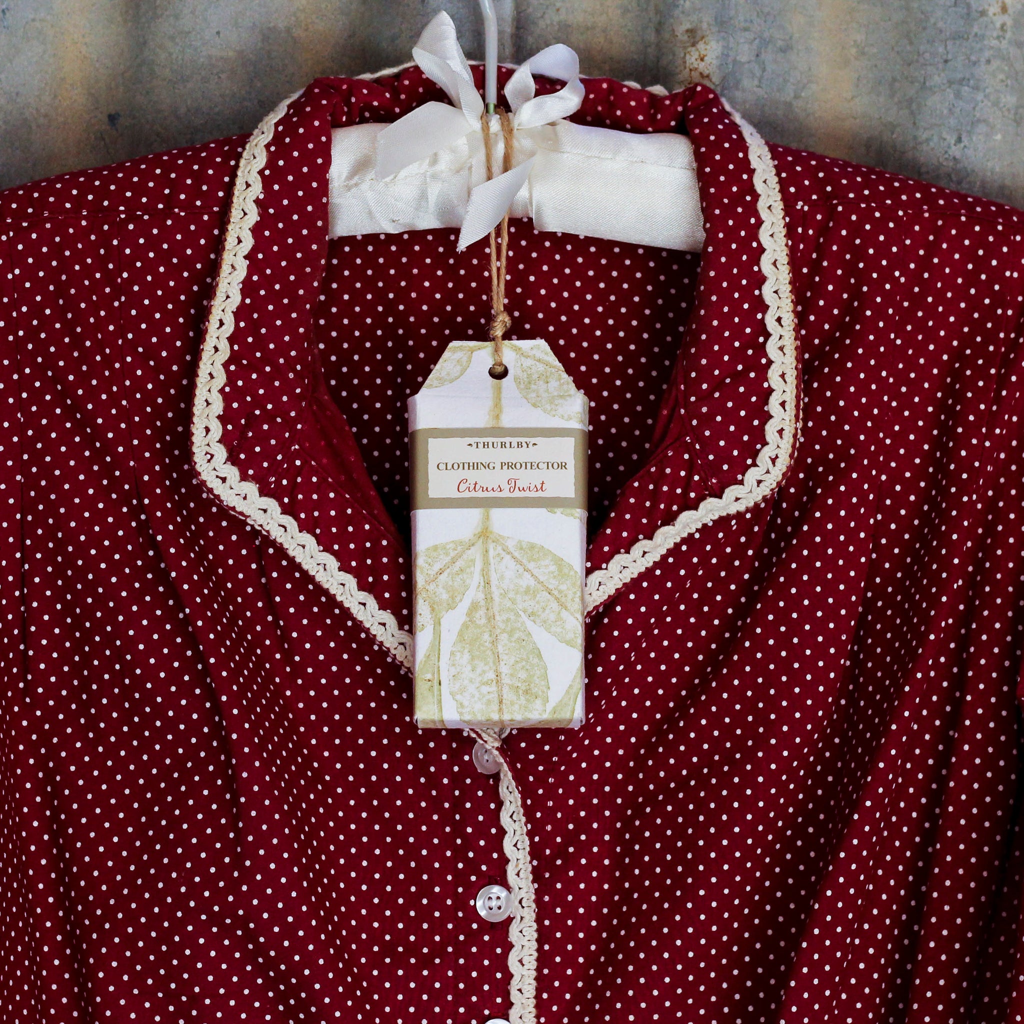 Thurlby Clothing Protector - Citrus Twist on shirt hanger