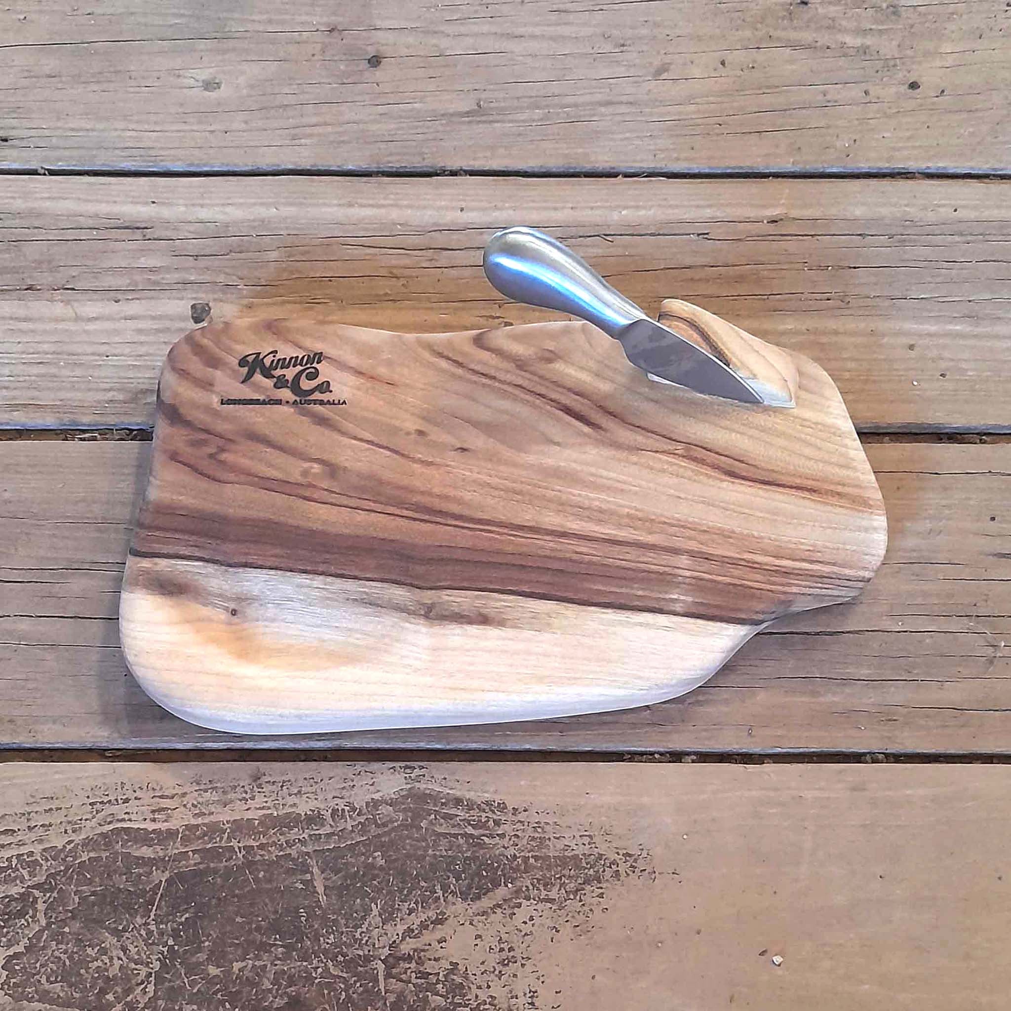 Kinnon and Co branded Camphor Laurel Cheeseboard with one brushed stainless steel knife. 