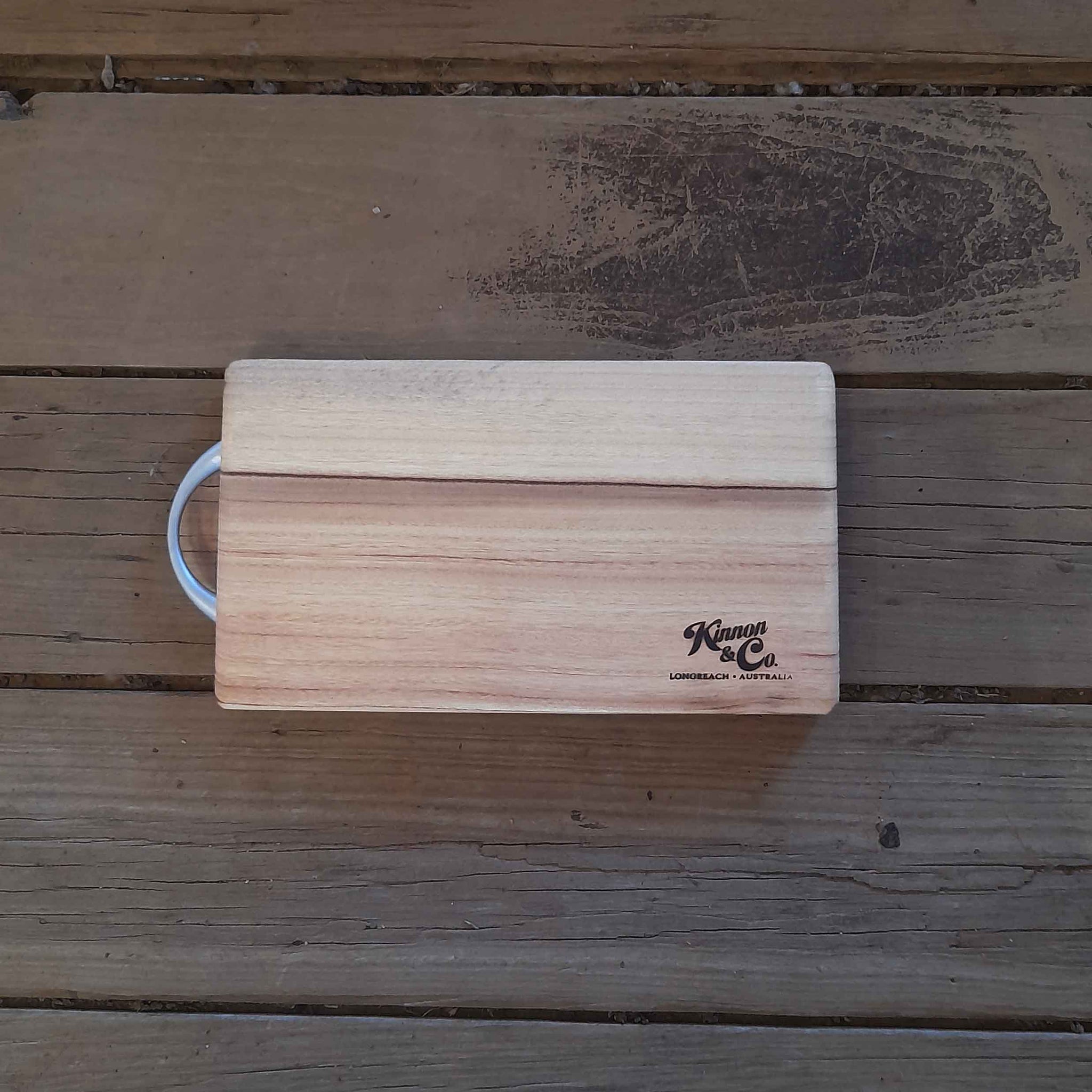 Kinnon and Co. Longreach Australia branded rectangular Camphor Laurel Chopping Board with Stainless Steel Handle. Small. 