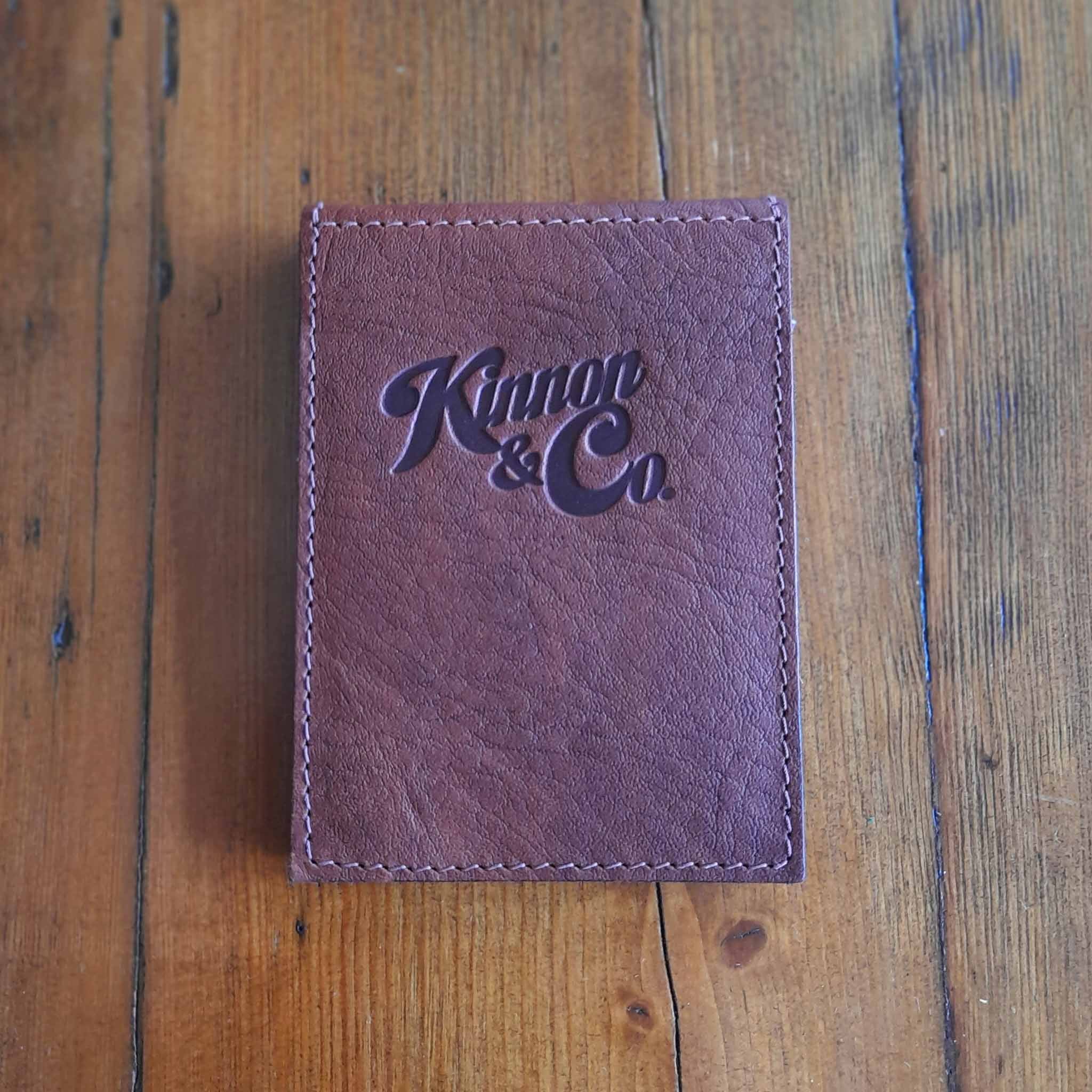 Kinnon and Co branded Pocket sized Tan Leather Notepad.