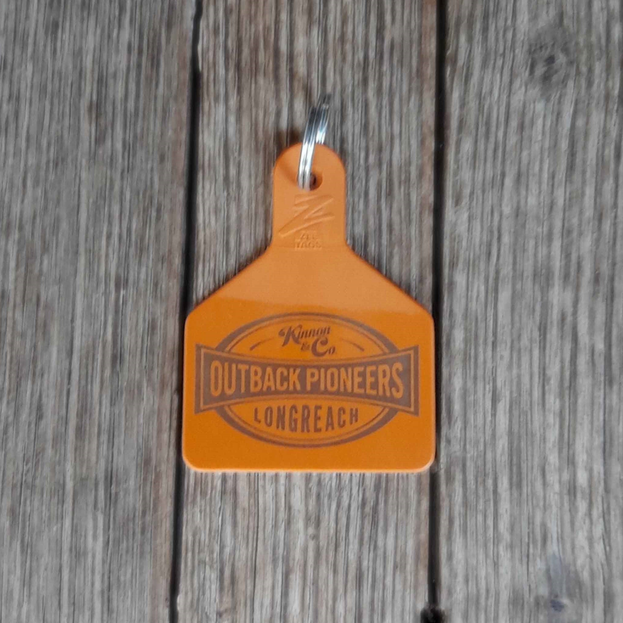 Outback Pioneers branded Cattle Tag Keyring brown. Back