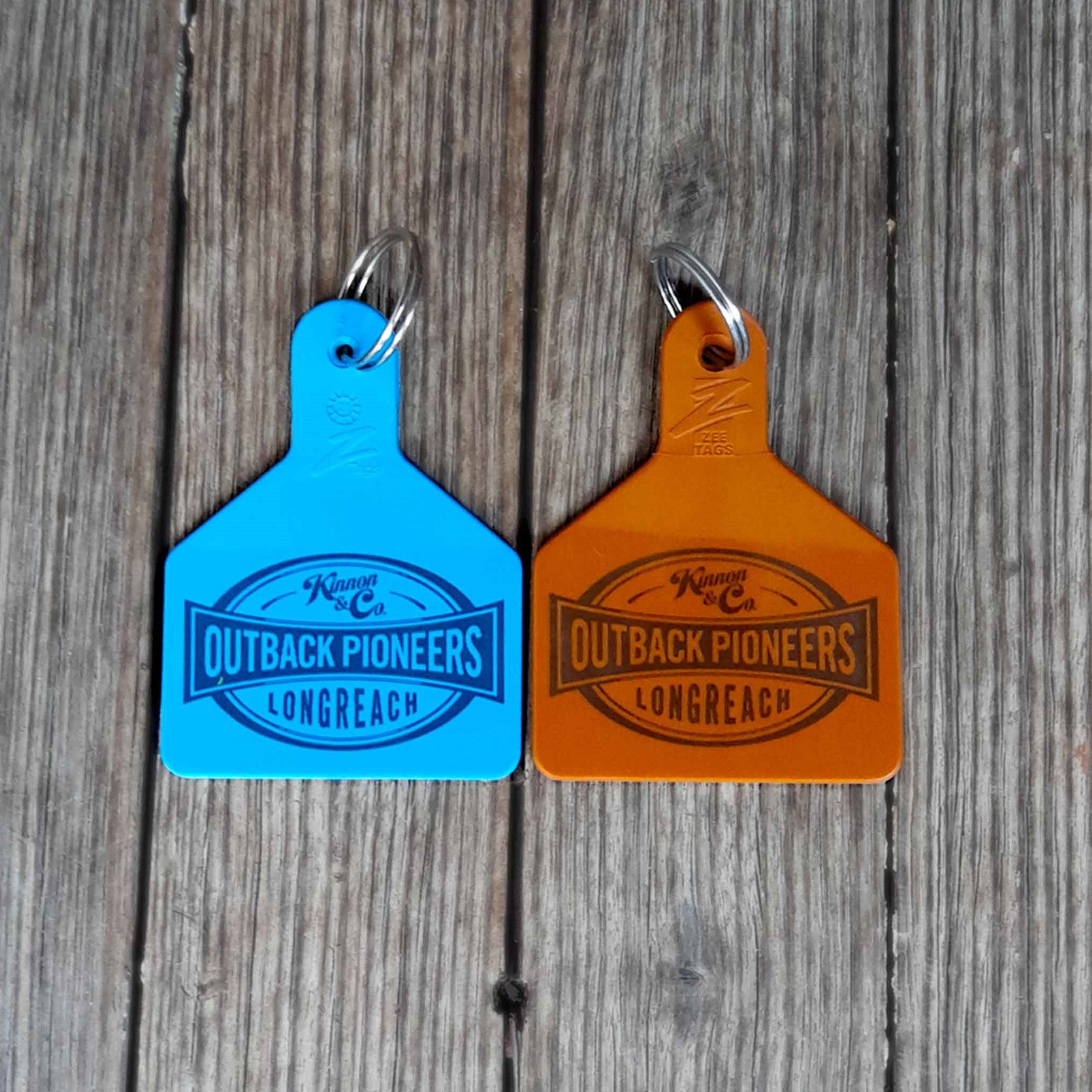 Outback Pioneers branded Cattle Tag Keyring Blue and brown. Back
