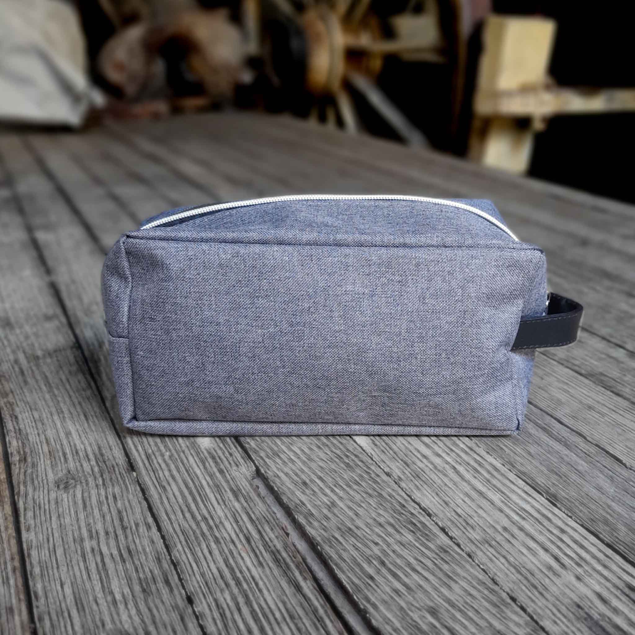 Outback Pioneers Toiletry Bag, grey heatherd finish and carry handle. Back View. 