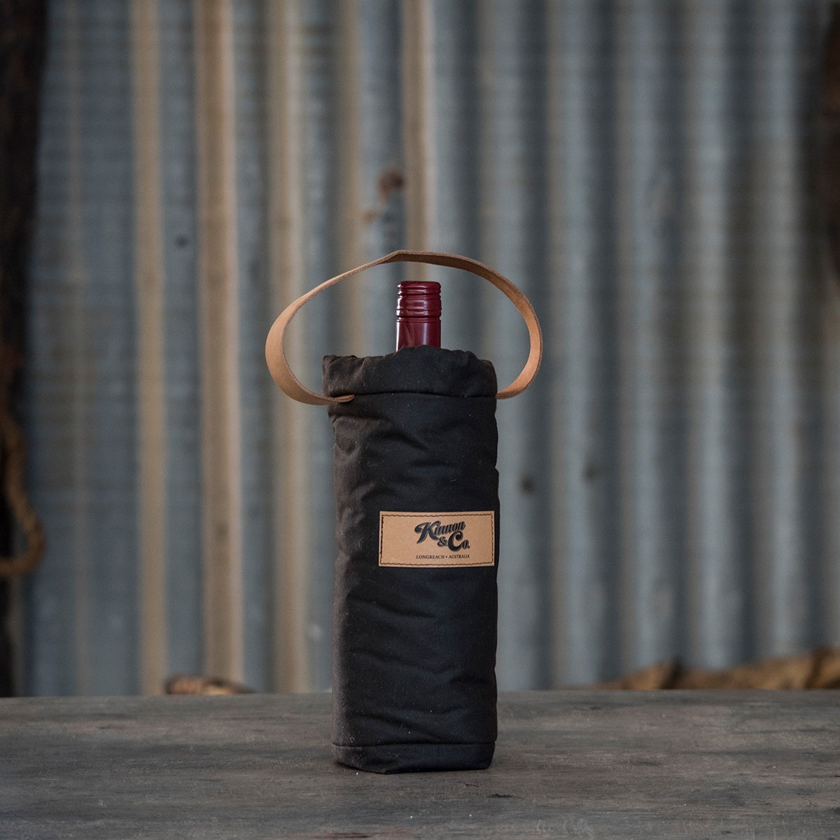 Kinnon and Co branded Oilskin Woolly Wine Cooler - Single Bottle. Leather handle